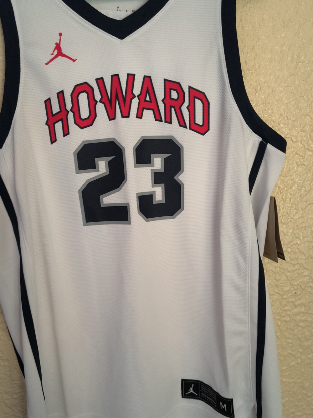 Jordan White Basketball Jersey with Black Trim and Red Accents